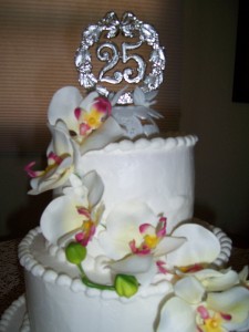 A white cake with flowers on top of it.