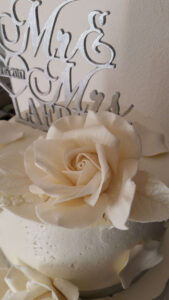 A white rose with the word " love ".